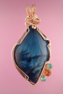 A Deep Indigo Victoria Stone with facetted Apatite and Carnelian.
