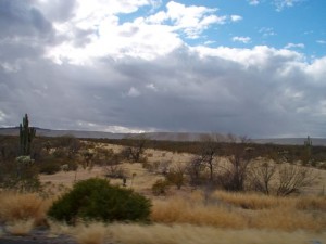 These hills are actually the Pima copper mine.  You can see the weather changed.  