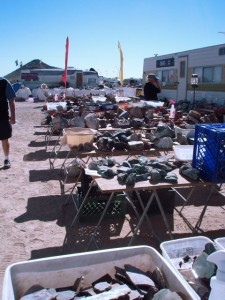 Tables piled high with rocks for sale at Quartzite.