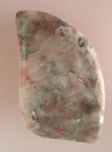 Patricianite with silver and copper inclusions.