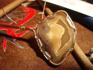 Lucy's Agate on my workbench.  Do you see the face?