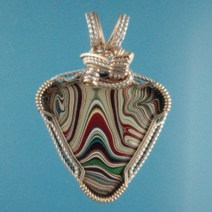 I like this piece. It is rare to find green in Fordite.