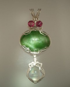 Catseye Jade is set off by Sunstone and Faceted Topaz