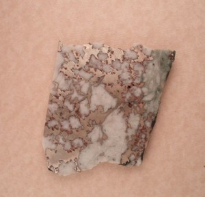A silvery slab of Mohawkite.  Siver coloration in probably due to high Nickel content.