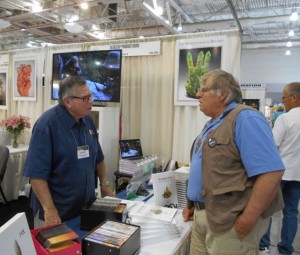 Discussing rocks with Dave Wilbur.  Dave is seen in the "What's Hot in Tucson" video series produced by Brian Swoboda every year.  What's hot in Tucson this year.  Dave said it was the Collector's Edge Display, and I agree.