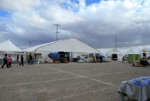 Low crowds and piles of rocks (bags of geodes)