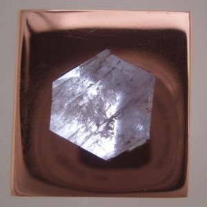 A Copper included cube of Quartz inhabits a piece of float Copper