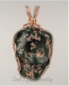 A big. bold Greenstone with Pink prehnite from Isle Royale in the 1940's.