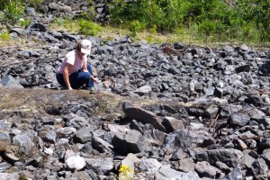 Bonnie is picking up small pieces of Specular Hematite for kids grab bags.