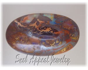 Fine Koroit Boulder Opal. Sorry, I really have a reflection issue with the Ironstone matrix.