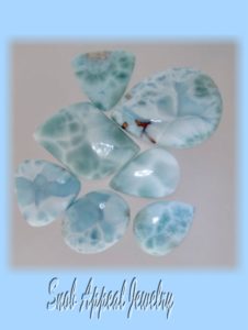 Six Larimar cabs, one has copper in it