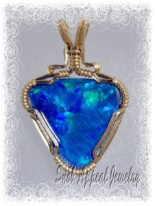 A stunning example of blue stone jewelry, a Lightning Ridge opal