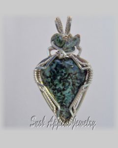 Greenstone pendant with greenstone beads
