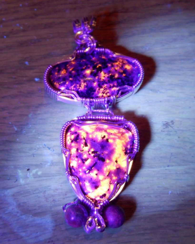 Fluorescent Sodalite Granite Pendant under UV light