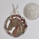 Horsing Around carved Unakite Pendant.